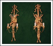Coppia di apliques in legno dorato ad oro zecchino.
